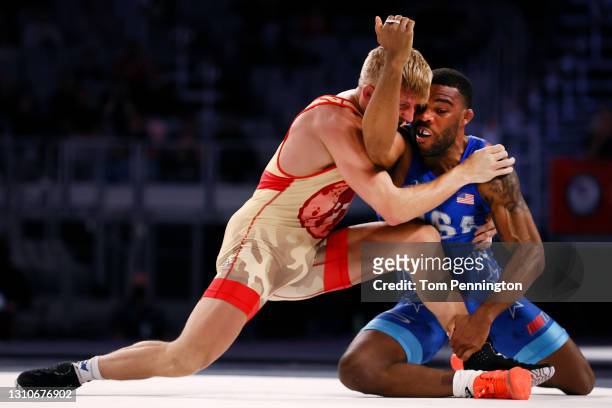 Jordan Burroughs competes against Kyle Dake in their Freestyle 74kg finals match on day 2 of the U.S. Olympic Wrestling Team Trials at Dickies Arena...