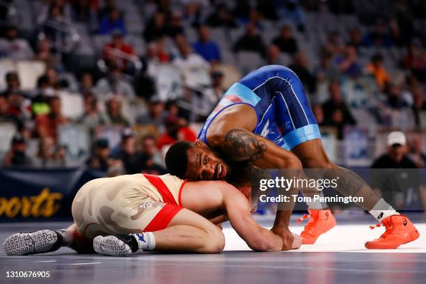 Jordan Burroughs competes against Kyle Dake in their Freestyle 74kg finals match on day 2 of the U.S. Olympic Wrestling Team Trials at Dickies Arena...