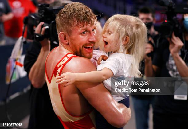 Kyle Dake celebrates with his family after defeating Jordan Burroughs in their Freestyle 74kg finals match on day 2 of the U.S. Olympic Wrestling...