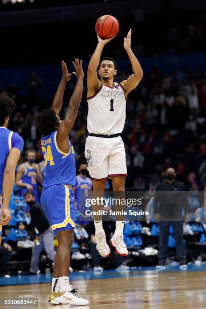 Jalen Suggs of the Gonzaga Bulldogs shoots a game-winning three point basket in overtime to defeat the UCLA Bruins 93-90 during the 2021 NCAA Final...