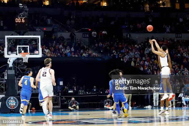 Jalen Suggs of the Gonzaga Bulldogs shoots a game-winning three point basket in overtime to defeat the UCLA Bruins 93-90 during the 2021 NCAA Final...