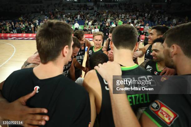Kyle Adnam of the Phoenix celebrates with teammates after winning the round 12 NBL match between the South East Melbourne Phoenix and the New Zealand...