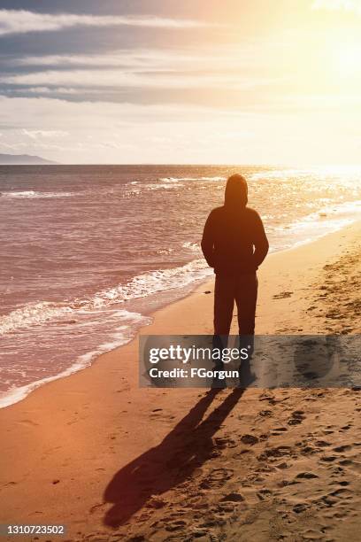 lonely and unhappy teenage boy - weakness stock pictures, royalty-free photos & images