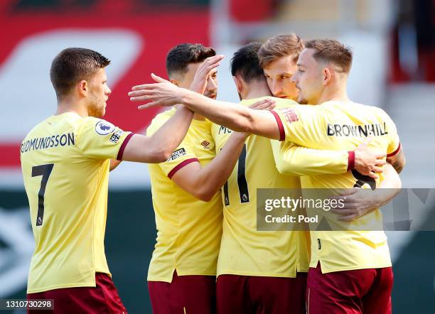 Chris Wood of Burnley celebrates with teammates Johann Gudmundsson, Matthew Lowton, Dwight McNeil and Josh Brownhill after scoring their team's first...