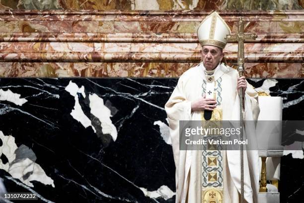 Pope Francis presides over Mass on Easter Sunday morning in St. Peter’s Basilica at the Altar of the Chair on April 04, 2021 in Vatican City,...