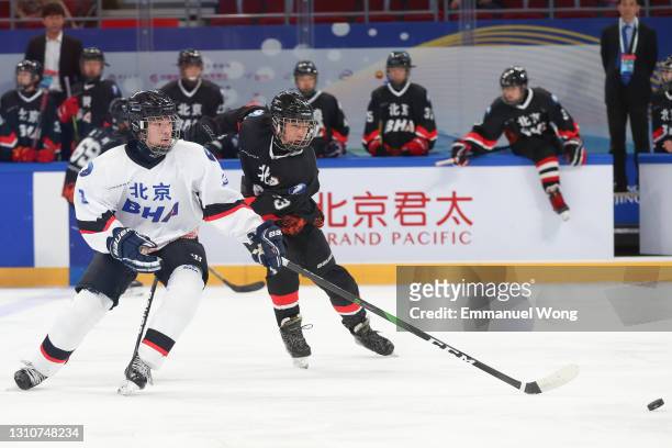 Chinese youth players compete during a game at the ice hockey test event for the Beijing 2022 Winter Olympics at the Wukesong Sports Centre on April...