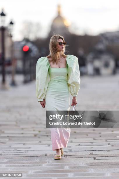 Natalia Verza @mascarada.paris wears sunglasses, a pastel colored green and pink oversized tie and dye midi dress with low-neck and puff large...