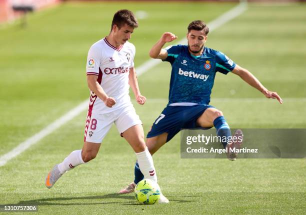 Manuel Fuster of Albacete BP is challenged by Oscar Gil of RCD Espanyol during the Liga Smartbank match between Albacete BP and RCD Espanyol de...