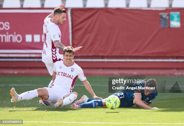 Oscar Gil of RCD Espanyol is fouled by Manuel Fuster of Albacete BP during the Liga Smartbank match between Albacete BP and RCD Espanyol de Barcelona...