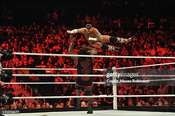 Punk and Mark Henry battle during their WWE match at the WWE Monday Night Raw Supershow Halloween event at the Philips Arena on October 31, 2011 in...