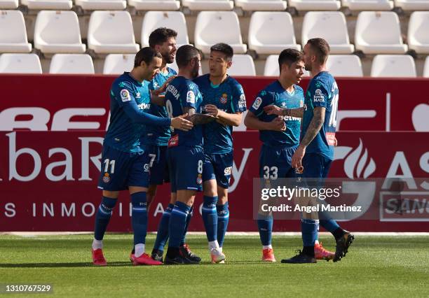 Raul de Tomas of RCD Espanyol celebrates with team mates after scoring their side's third goal during the Liga Smartbank match between Albacete BP...