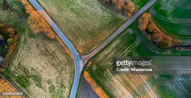 asphalt and dirt road in landscape - denmark road stock pictures, royalty-free photos & images
