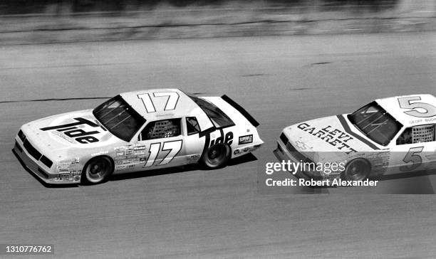 Driver Darrell Waltrip passes Geoff Bodine during the running of the 1986 Daytona 500 stock car race at Daytona International Speedway in Daytona...