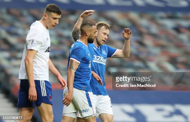 Kemar Roofe of Rangers is congratulated by teammate Scott Arfield of Rangers after scoring their side's third goal during the William Hill Scottish...