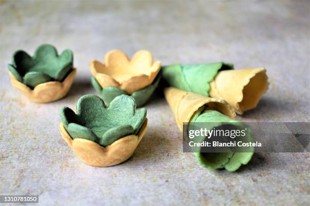 colorful vol au vent and ice cream cones on a table - vol au vent stockfoto's en -beelden