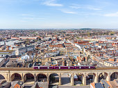 Mansfield England Cityscape aerial view of town with big long stone railway viaduct arches train passing over bridge with town and old market place from high view summer sky