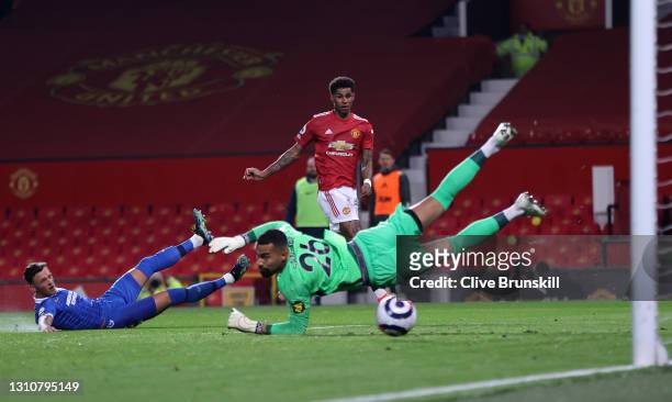 Marcus Rashford of Manchester United scores their team's first goal past Robert Sanchez of Brighton & Hove Albion during the Premier League match...