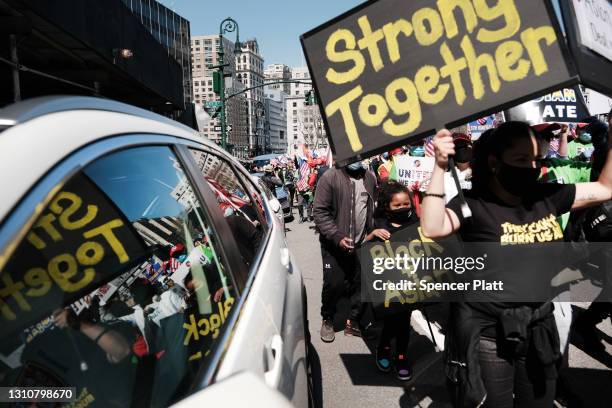 People participate in a protest to demand an end to anti-Asian violence on April 04, 2021 in New York City. The group, which numbered near 3000 and...