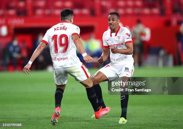 Marcos Acuna of Sevilla FC celebrates with teammate Fernando after scoring their team's first goal during the La Liga Santander match between Sevilla...