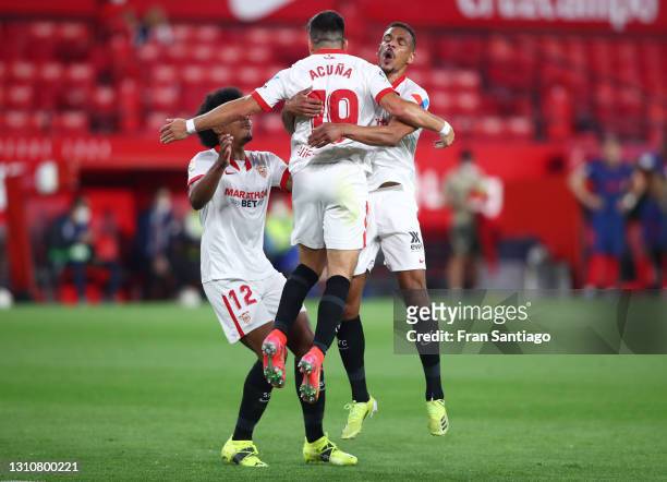 Marcos Acuna of Sevilla FC celebrates with teammates Jules Kounde and Fernando after scoring their team's first goal during the La Liga Santander...