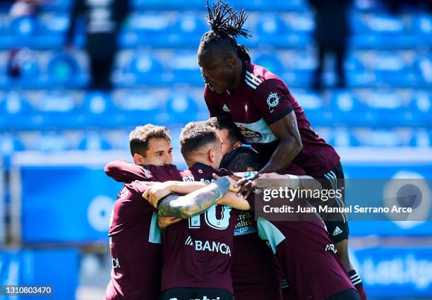 Santi Mina of Celta de Vigo celebrates with his teammates Hugo Mallo, Iago Aspas, Joseph Aldoo and Manuel Agudo "Nolito" of Celta de Vigo after...