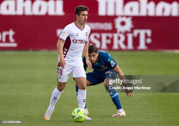 Manuel Fuster of Albacete BP is challenged by Oscar Gil of RCD Espanyol during the Liga Smartbank match between Albacete BP and RCD Espanyol de...