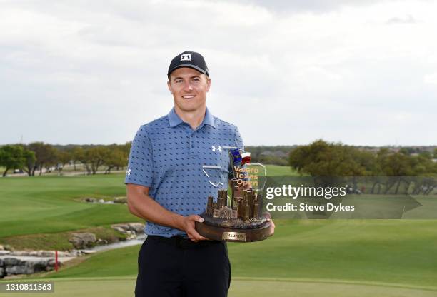 Jordan Spieth poses with the trophy after putting in to win during the final round of Valero Texas Open at TPC San Antonio Oaks Course on April 04,...