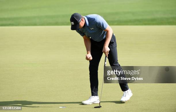 Jordan Spieth reacts after putting in to win on the 18th green during the final round of Valero Texas Open at TPC San Antonio Oaks Course on April...