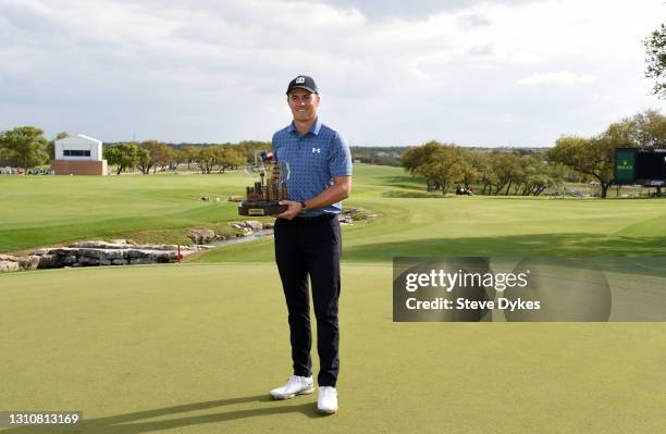 Jordan Spieth poses with the trophy after putting in to win during the final round of Valero Texas Open at TPC San Antonio Oaks Course on April 04,...