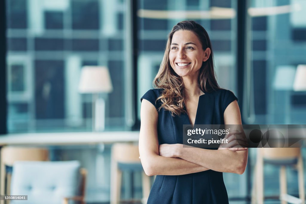 Portrait of a businesswoman standing in a a modern office