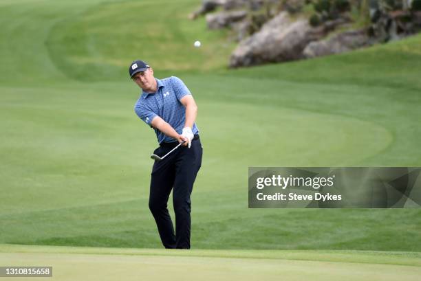 Jordan Spieth plays a shot on the 14th hole during the final round of Valero Texas Open at TPC San Antonio Oaks Course on April 04, 2021 in San...