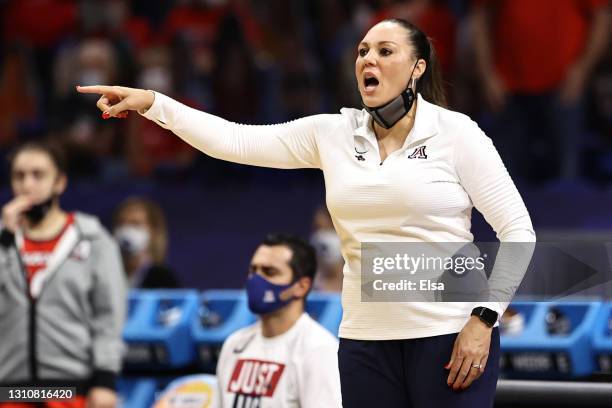 Head coach Adia Barnes of the Arizona Wildcats yells to her team against the Stanford Cardinal in the National Championship game of the 2021 NCAA...