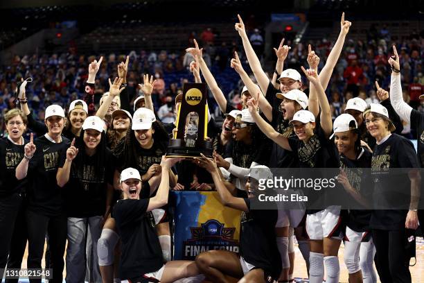 Members of the Stanford Cardinal celebrate with the championship trophy after defeating the Arizona Wildcats in the National Championship game of the...