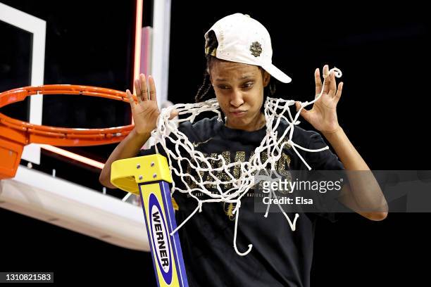 Kiana Williams of the Stanford Cardinal celebrates after cutting down the net following the team's win against the Arizona Wildcats in the National...