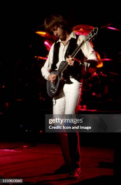 English rock guitarist, songwriter James Honeyman-Scott , of the English-American rock band The Pretenders, plays on stage during The Pretenders II...