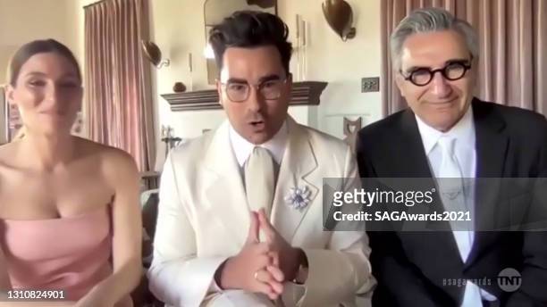 In this screengrab released on April 4 Sarah Levy, Dan Levy, and Eugene Levy, winners of Outstanding Performance by an Ensemble in a Comedy Series...