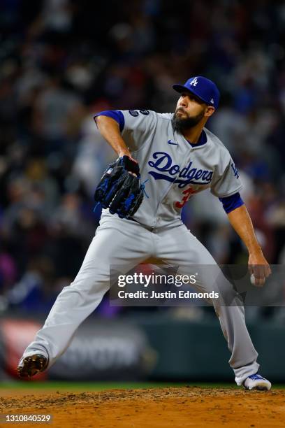 Relief pitcher David Price of the Los Angeles Dodgers delivers to home plate during the seventh inning against the Colorado Rockies at Coors Field on...