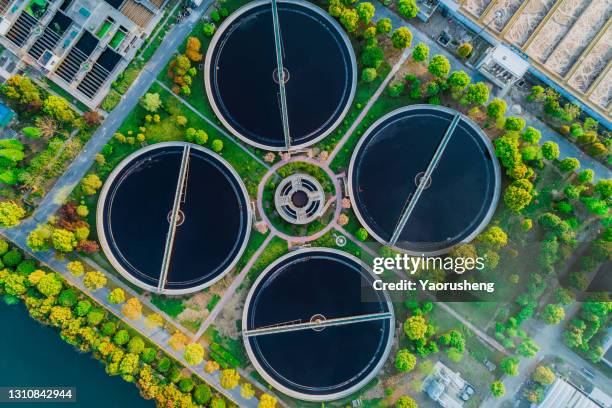 bird aerial view of purification tanks of modern wastewater treatment plant - filter and sort stockfoto's en -beelden