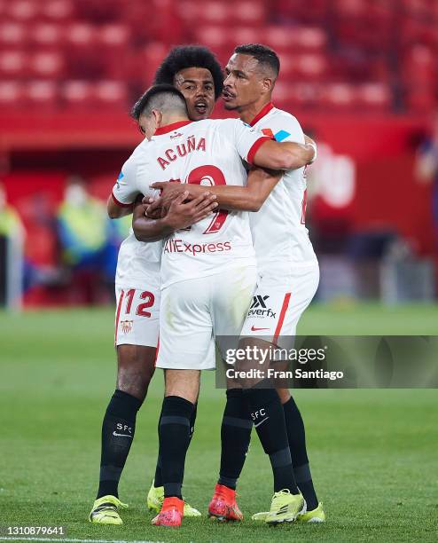 Marcos Acuna of Sevilla FC celebrates scoring a goal with team mates during the La Liga Santander match between Sevilla FC and Atletico de Madrid at...