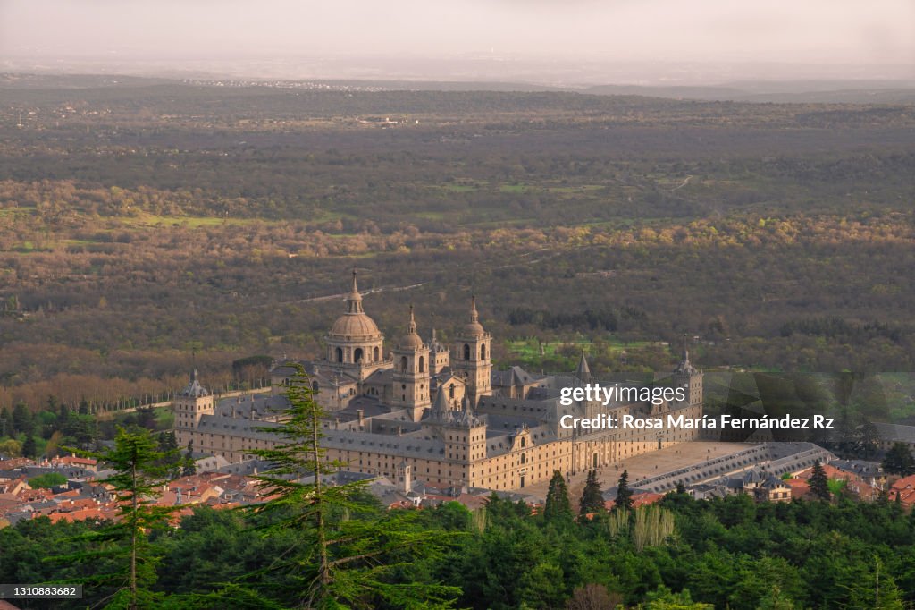 Distant view of Monasterio de El Escorial and the town of San Lorenzo de El escorial, Madrid. Spain.