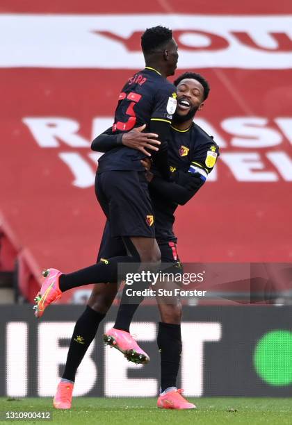 Ismaila Sarr of Watford celebrates with team mate Nathaniel Chalobah after scoring their side's first goal during the Sky Bet Championship match...