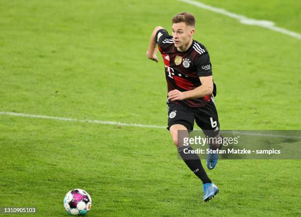 Joshua Kimmich of Bayern Muenchen runs with a ball during the Bundesliga match between RB Leipzig and FC Bayern Muenchen at Red Bull Arena on April...