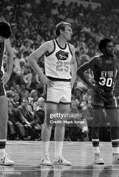 New York Nets center Swen Nater, Denver Nuggets center Dan Issel and New York Nets guard Al Skinner stand at the free throw line during an ABA...