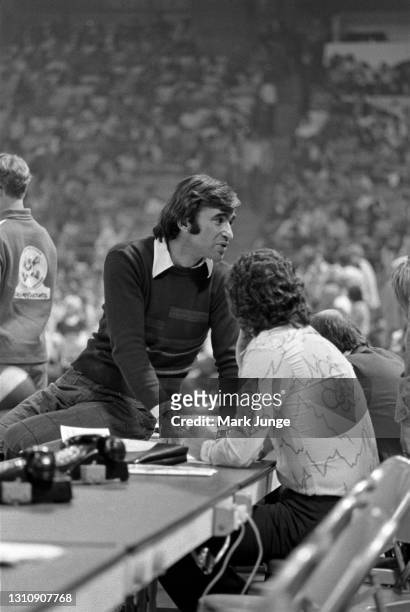 Denver Nuggets general manager Carl Scheer sits on the scorer’s table prior to an ABA basketball game between the Denver Nuggets and the New York...