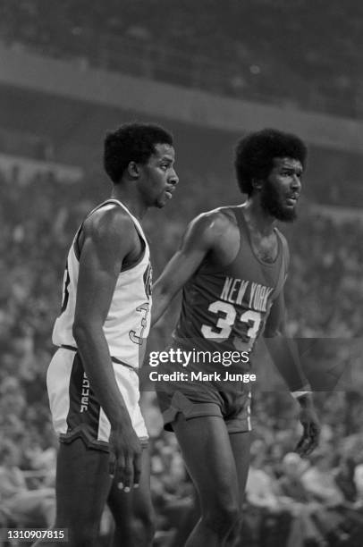 Denver Nuggets forward David Thompson and New York Nets forward Rich Jones prepare for a play during an ABA basketball game at McNichols Arena on...