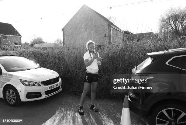 Sophie Paine of Cambridge talks to her family after victory in The Gemini Boat Race on April 04, 2021 in Ely, England. Due to current strict social...