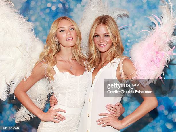 Models Candice Swanepoel and Erin Heatherton attend the Victoria's Secret launch of the Angel fragrance and the Dream Angels bra at Victoria's...