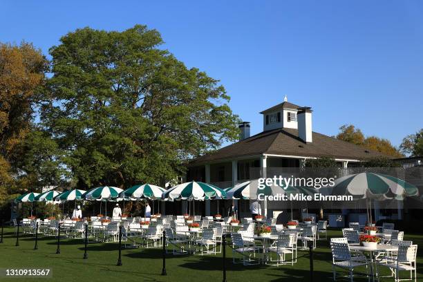 General view of umbrellas, chairs and tables outside of the clubhouse during a practice round prior to the Masters at Augusta National Golf Club on...