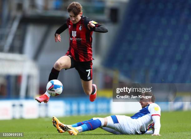 David Brooks of AFC Bournemouth jumps over Barry Douglas of Blackburn Rovers during the Sky Bet Championship match between Blackburn Rovers and AFC...