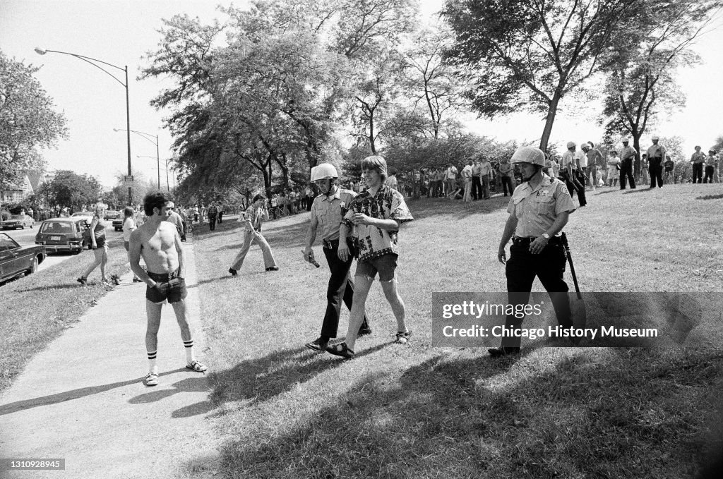 59 Riot Aftermath Police escorting a person from Marquette Park in Chicago, Illinois ...
